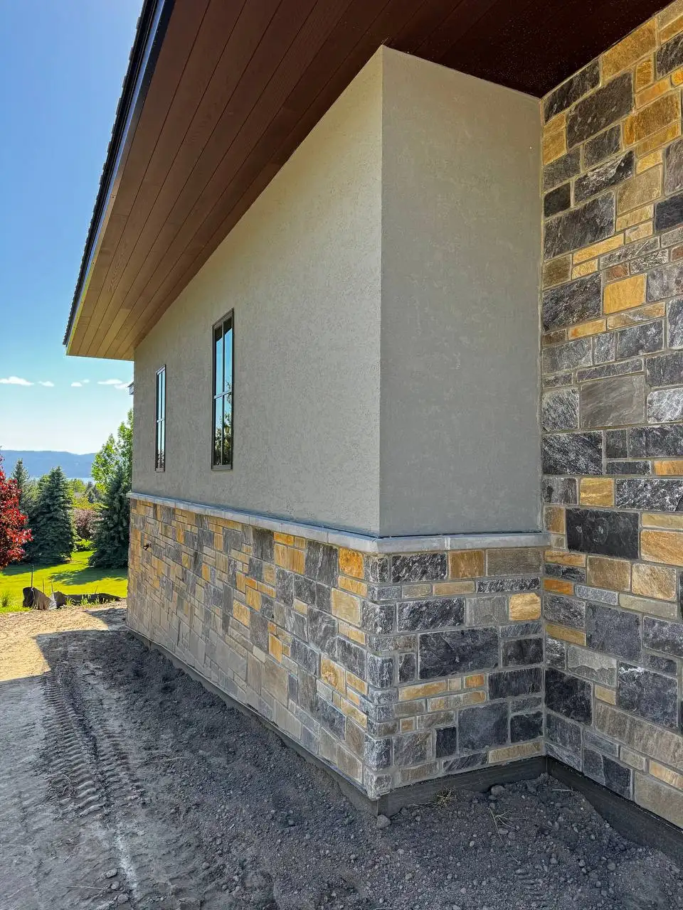 Close up of premium stucco and stone craftsmanship by DL Construction